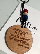 Cargar imagen en el visor de la galería, Positive Keychain- Aprendí a ser fuerte cuando entendí que todo cambia. @wemiarts